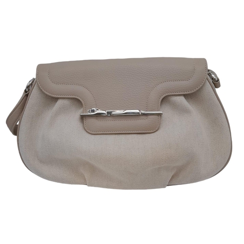 268 - A Cartier Beige Canvas and Leather Shoulder Bag. Fold over top closure. Silver-tone hardware. Leopar... 