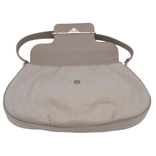 268 - A Cartier Beige Canvas and Leather Shoulder Bag. Fold over top closure. Silver-tone hardware. Leopar... 