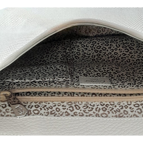 268 - A Cartier Beige Canvas and Leather Shoulder Bag. Fold over top closure. Silver-tone hardware. Leopar... 