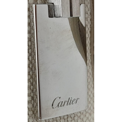 268 - A Cartier Beige Canvas and Leather Shoulder Bag. Fold over top closure. Silver-tone hardware. Leopar... 