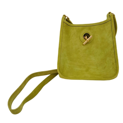 275 - A Vintage Hermes Green Suede Shoulder Bag. Olive green suede exterior with gold-tone furniture. Gree... 