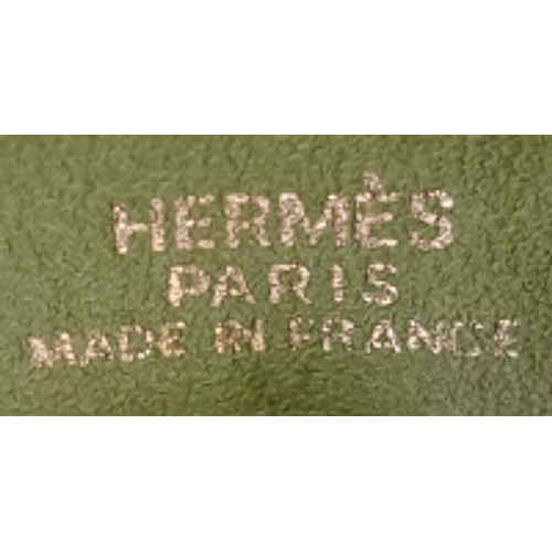 275 - A Vintage Hermes Green Suede Shoulder Bag. Olive green suede exterior with gold-tone furniture. Gree... 