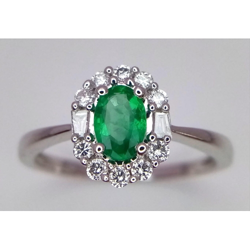 317 - A WGI certified oval cut emerald ring with round brilliant cut and baguette cut diamonds. Emerald - ... 