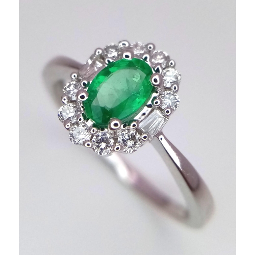 317 - A WGI certified oval cut emerald ring with round brilliant cut and baguette cut diamonds. Emerald - ... 