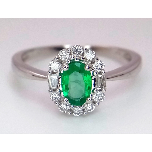 317 - A WGI certified oval cut emerald ring with round brilliant cut and baguette cut diamonds. Emerald - ... 