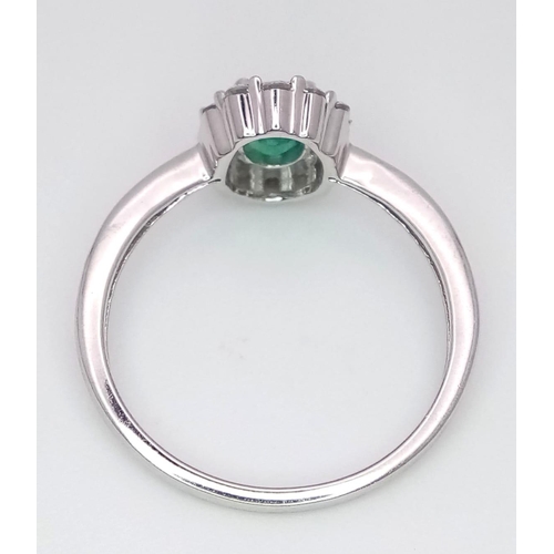 317 - A WGI certified oval cut emerald ring with round brilliant cut and baguette cut diamonds. Emerald - ... 