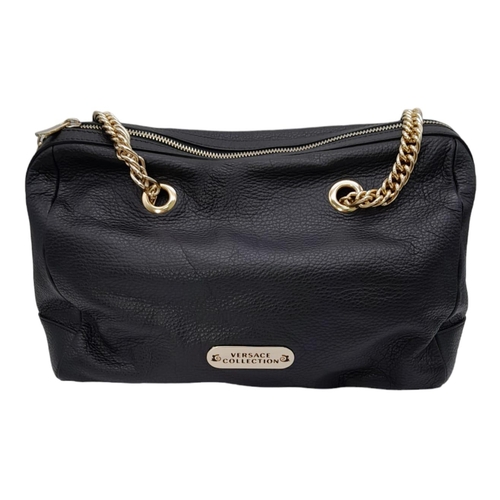 465 - A Versace Collection Black Textured Leather Handbag. Black leather exterior with gilded main zip. Go... 