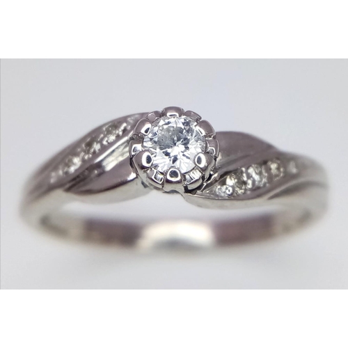 522 - 9K WHITE GOLD DIAMOND RING 0.12CT 

WEIGHT: 2.8G 
SIZE L