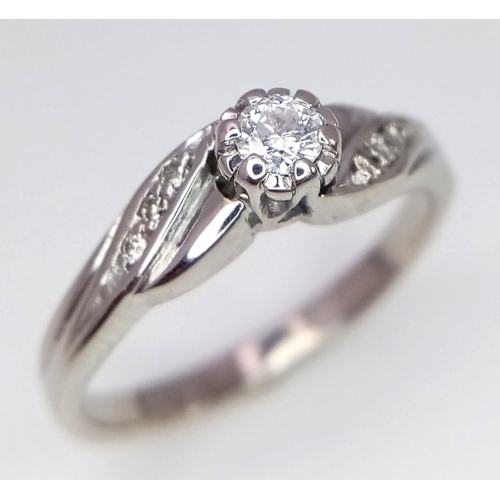 522 - 9K WHITE GOLD DIAMOND RING 0.12CT 

WEIGHT: 2.8G 
SIZE L