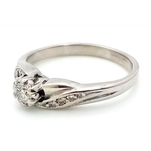 522 - 9K WHITE GOLD DIAMOND RING 0.12CT 

WEIGHT: 2.8G 
SIZE L