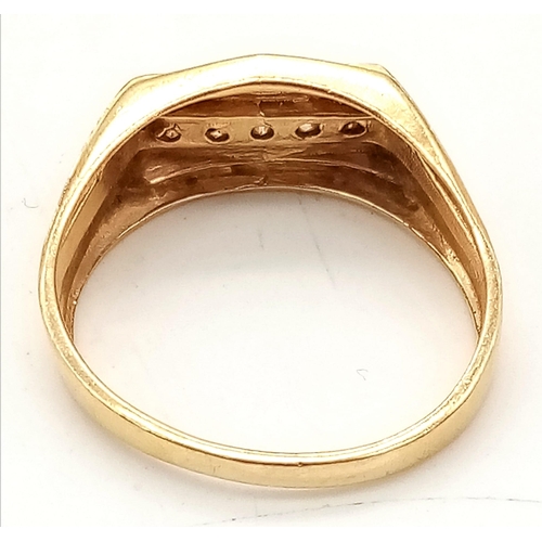 674 - A GENTS 14K GOLD RING WITH 5 DIAMONDS CHANNEL SET IN ATTRACTIVE DESIGN .   5.3gms   size Y