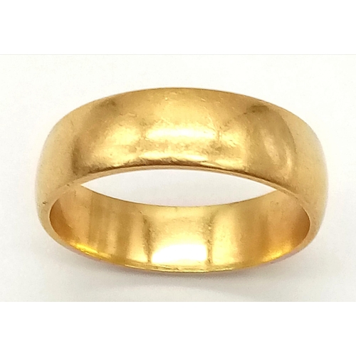 775 - AN 18K GOLD BAND RING .   4.64gms   size N