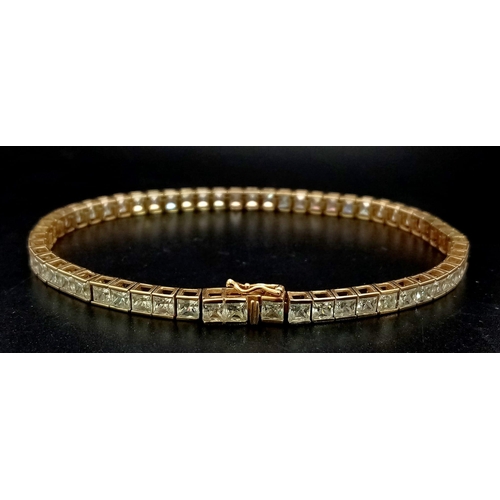 97 - A LOVELY 9K YELLOW GOLD STONE SET TENNIS BRACELET, WEIGHT 10G AND 19CM LONG APPROX