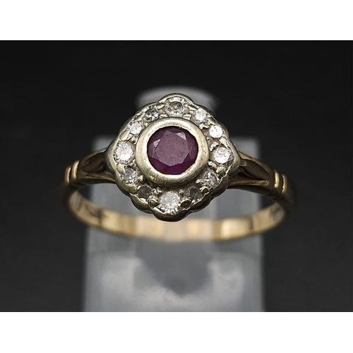 124 - A Vintage 9K Yellow Gold Ruby and Diamond Ring. Central ruby with a halo of diamonds. Size N. 2.25g ... 