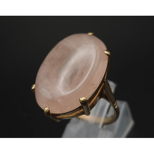 158 - A Vintage 9K Yellow Gold Rose Quartz Ring. Large rose quartz cabochon. Size M. 8g total weight.