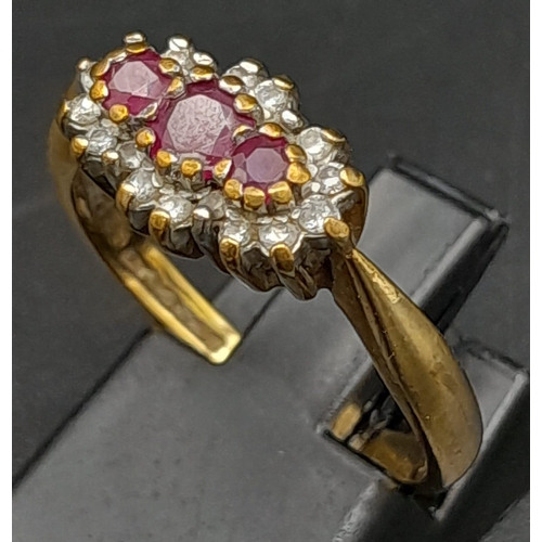 165 - A Vintage 9K Yellow Gold Garnet and Diamond Ring. Three garnets surrounded with a halo of diamonds. ... 