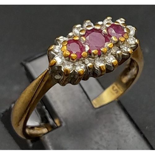 165 - A Vintage 9K Yellow Gold Garnet and Diamond Ring. Three garnets surrounded with a halo of diamonds. ... 