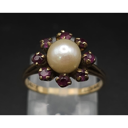 171 - A Vintage 9K Yellow Gold Pearl and Garnet Ring. Central pearl with a halo of garnets. Size K. 2.95g ... 