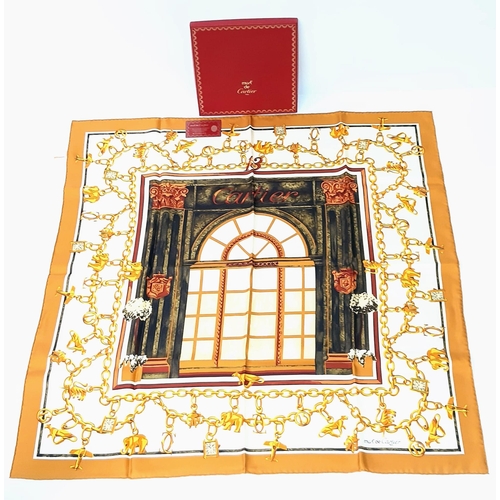 221 - A Cartier Silk Scarf. As new, in Cartier box with authenticity card.