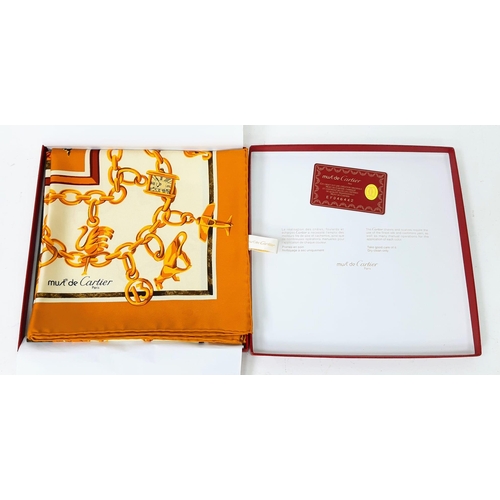 221 - A Cartier Silk Scarf. As new, in Cartier box with authenticity card.