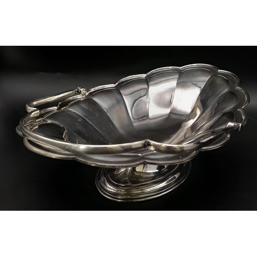 25 - A SOLID SILVER FRUIT DISH WITH HANDLE DATED 1912 AND MADE IN SHEFFIELD , NICE CONDITION FOR AGE .   ... 