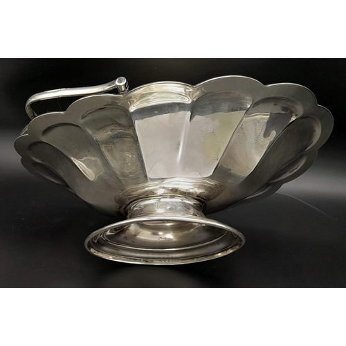 25 - A SOLID SILVER FRUIT DISH WITH HANDLE DATED 1912 AND MADE IN SHEFFIELD , NICE CONDITION FOR AGE .   ... 