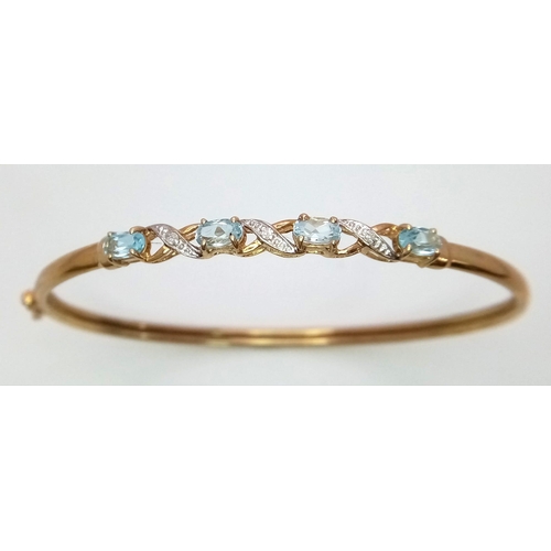 256 - An Italian 9K Yellow Gold Aquamarine and Diamond Clip Open Bangle. 6cm inner diameter. 4.05g total w... 