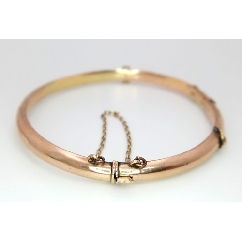 269 - A Vintage 9K Rose Gold Bangle. Clip open design. 58mm inner diameter. 5.23g weight.