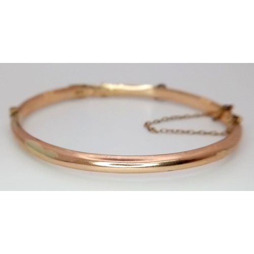 269 - A Vintage 9K Rose Gold Bangle. Clip open design. 58mm inner diameter. 5.23g weight.