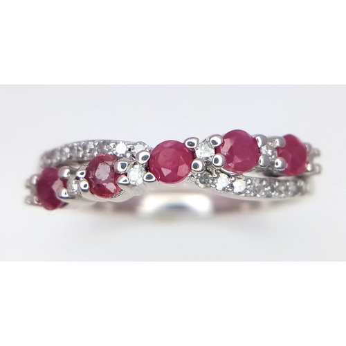 328 - 9K WHITE GOLD DIMAOND & RUBY CROSS OVER BAND RING 0.12CT 

WEIGHT: 2.5G 
SIZE L