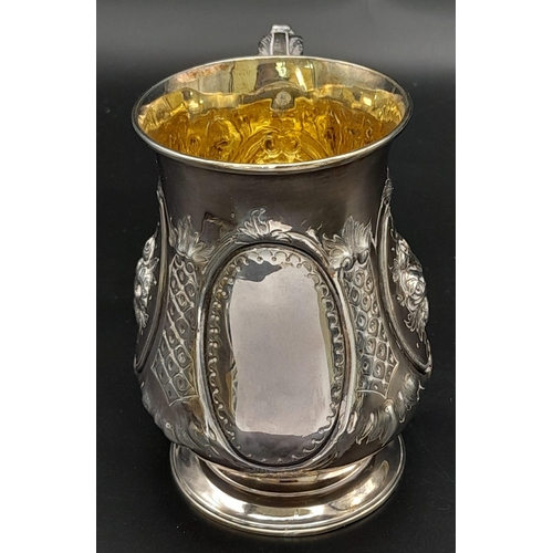 33 - AN EARLY VICTORIAN SILVER TANKARD MADE BY ADEY B SAVORY IN LONDON WITH INCREDIBLE HAND CHASED REPOUS... 