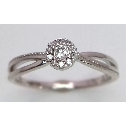 412 - 9K WHITE GOLD DIAMOND RING 0.10CT 

WEIGHT: 1.9G 
SIZE L