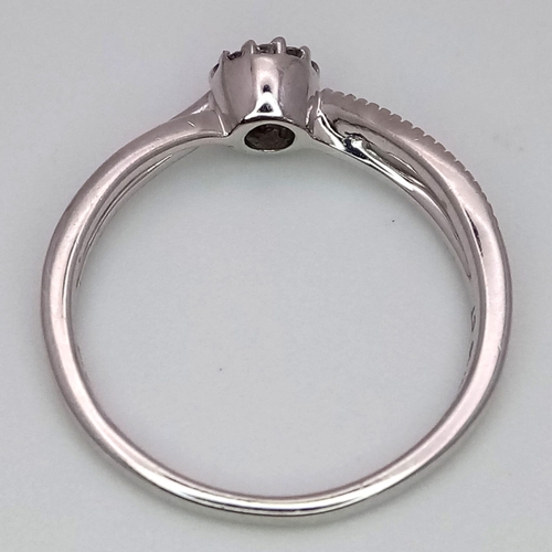 412 - 9K WHITE GOLD DIAMOND RING 0.10CT 

WEIGHT: 1.9G 
SIZE L