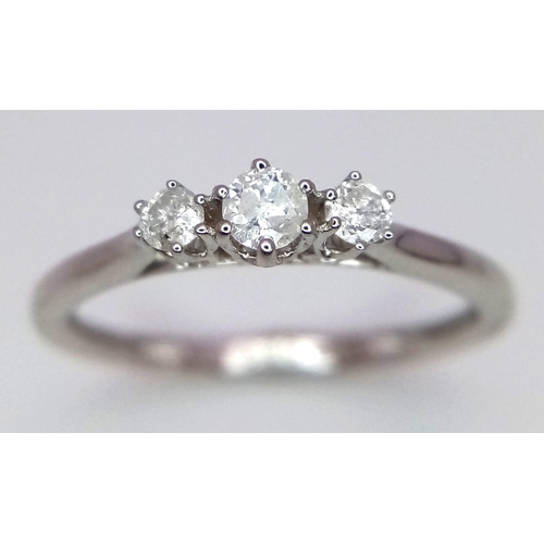 426 - 9K WHITE GOLD DIAMOND 3 STONE RING 0.20CT 

WEIGHT: 1.6G 
SIZE L