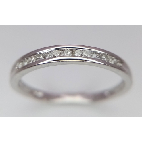 604 - 9K WHITE GOLD DIAMOND BAND RING 0.10CT 

WEIGHT: 1.2G 
SIZE K