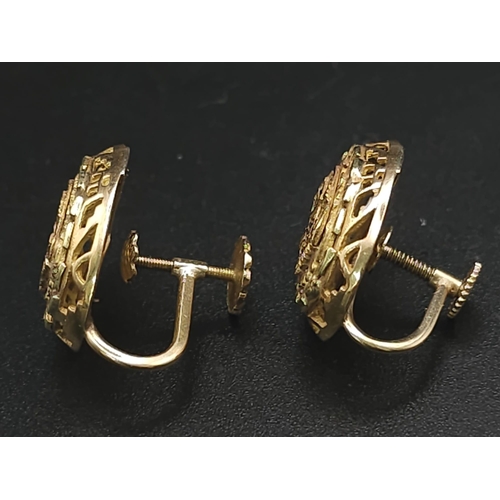 79 - A Pair of 14K Yellow Gold Decorative Indian Earrings. Filigree and pierced decoration. Screw clasp. ... 