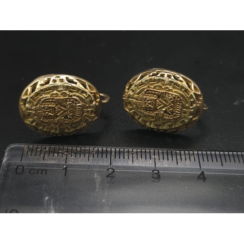 79 - A Pair of 14K Yellow Gold Decorative Indian Earrings. Filigree and pierced decoration. Screw clasp. ... 