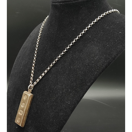 816 - A SOLID SILVER INGOT PENDANT ON A 54cms SILVER BELCHER CHAIN .   42gms