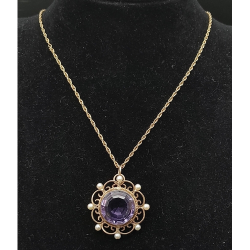 229 - A Victorian Mid Karat Gold, Amethyst and Seed Pearl Circular Pendant on a 9K Gold Delicate Prince of... 