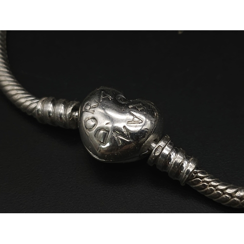 632 - PANDORA MOMENTS STERLING SILVER BRACELET WITH HEART CLASP 

WEIGHT: 14.5G