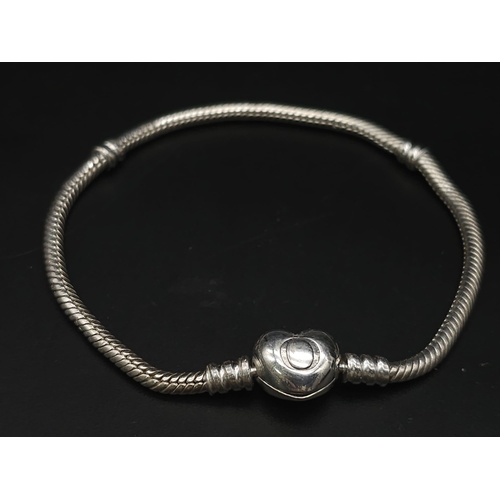 632 - PANDORA MOMENTS STERLING SILVER BRACELET WITH HEART CLASP 

WEIGHT: 14.5G