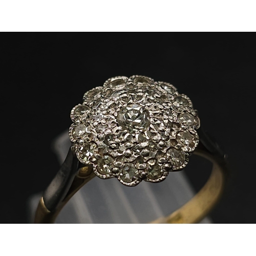 745 - A Vintage 18K Yellow Gold and Platinum Diamond Ring. An array of diamonds in a platinum setting. Siz... 