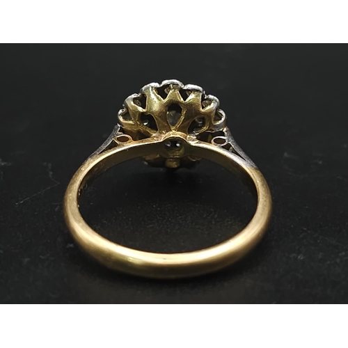 745 - A Vintage 18K Yellow Gold and Platinum Diamond Ring. An array of diamonds in a platinum setting. Siz... 