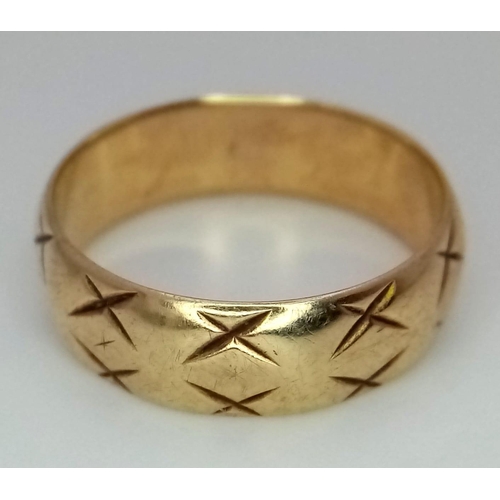 982 - A 9K GOLD BAND RING WITH THE 