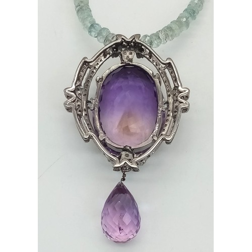 122 - A Stunning 49ct Amethyst Gemstone Drop Pendant with an intricate 1.5ctw Diamond halo - It comes with... 