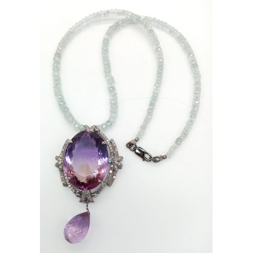 122 - A Stunning 49ct Amethyst Gemstone Drop Pendant with an intricate 1.5ctw Diamond halo - It comes with... 