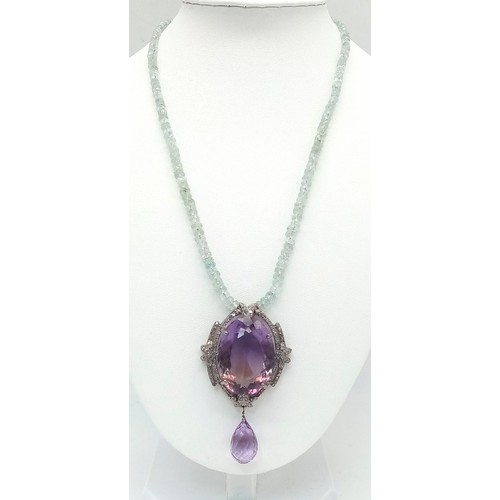 122 - A Stunning 49ct Amethyst Gemstone Drop Pendant with an intricate 1.5ctw Diamond halo - It comes with... 