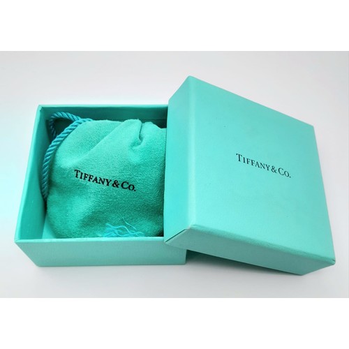 282 - A Tiffany and Co. Silver Ring. Size L/M. Original Tiffany packaging.