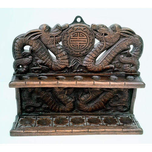 242 - An Antique (circa 1840) Chines Hand Carved Wood Opium Pipe Rack. Dragon decoration throughout.  31cm... 