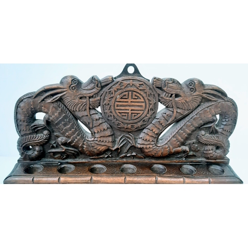 242 - An Antique (circa 1840) Chines Hand Carved Wood Opium Pipe Rack. Dragon decoration throughout.  31cm... 